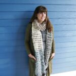 Lady starts crocheting over a LED lights strand. Try not to adore the result