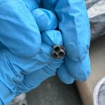 Lady piles terra-cotta pots and then paints with winter white. This one looks way more expensive than it is