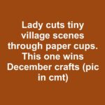 Lady drapes faux snow through evergreen garlands. Absolutely a top winter DIY