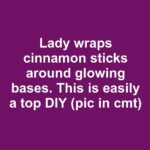 Lady drapes faux snow through evergreen garlands. Absolutely a top winter DIY